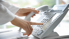 VoIP Phone Systems. A user makes a phone call
