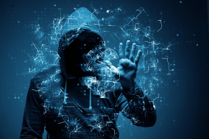 A man in a hoodie represents Cyber Fraud