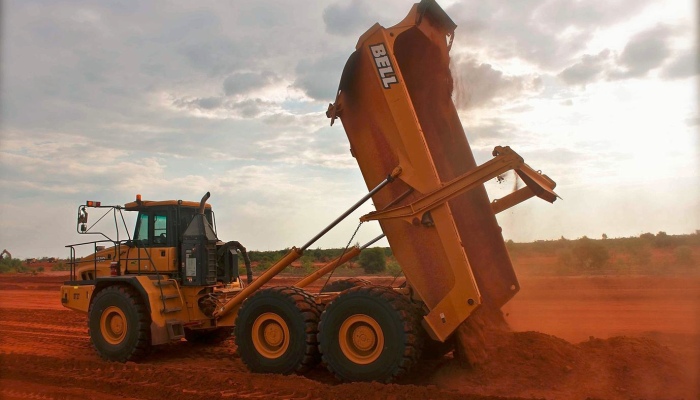 A QHM Birt truck building a road