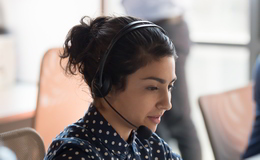 Is Outsourcing the same as Managed IT services? A woman works in a call centre